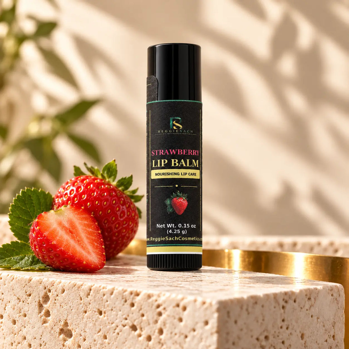 ReggieSach Strawberry Lip Balm — handcrafted lip balm, studio product photo with fresh strawberries